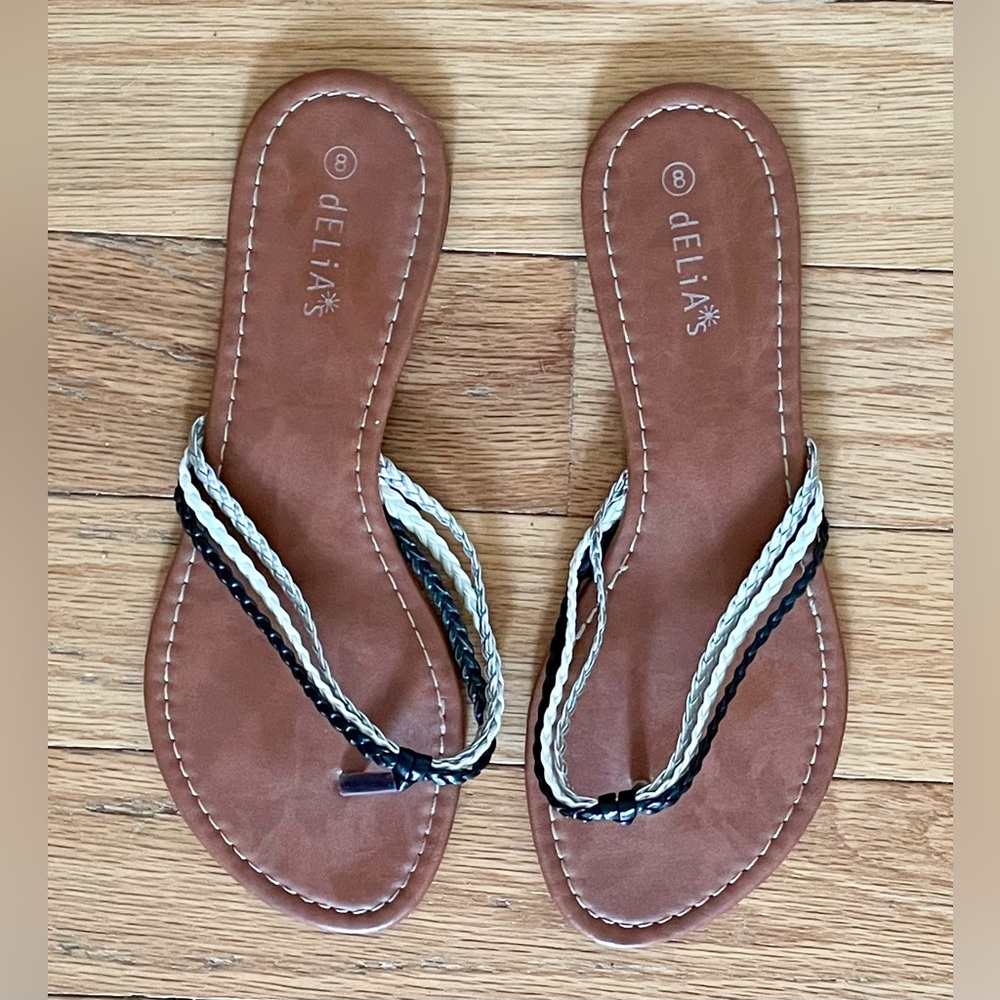 Delia’s thong sandals with black, white and silver braids, like new